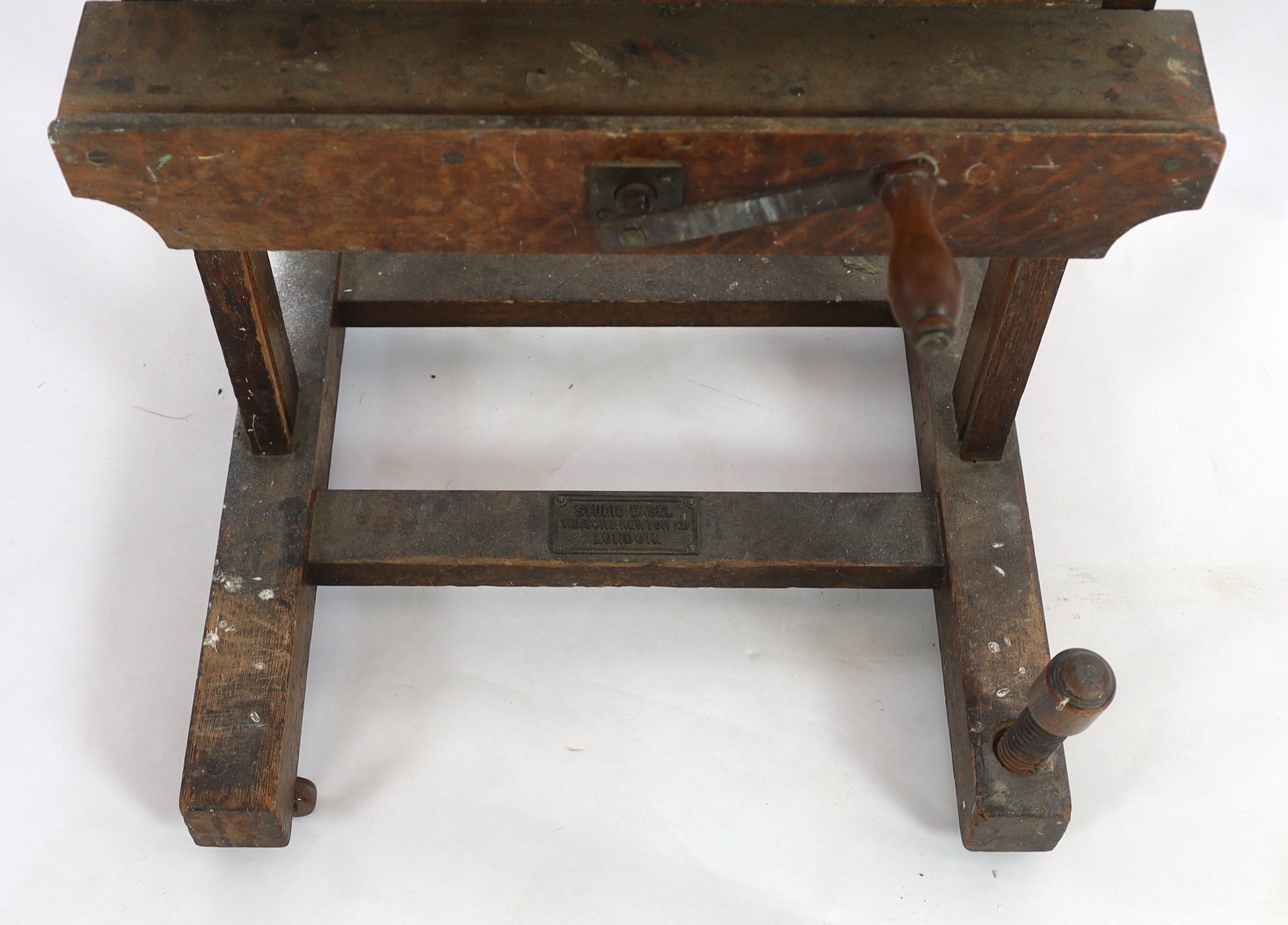 A Winsor & Newton oak studio easel, with cast brass plaque ‘Studio Easel, Winsor & Newton, Ltd, London’, 62cm wide, 64cm deep, 183cm high